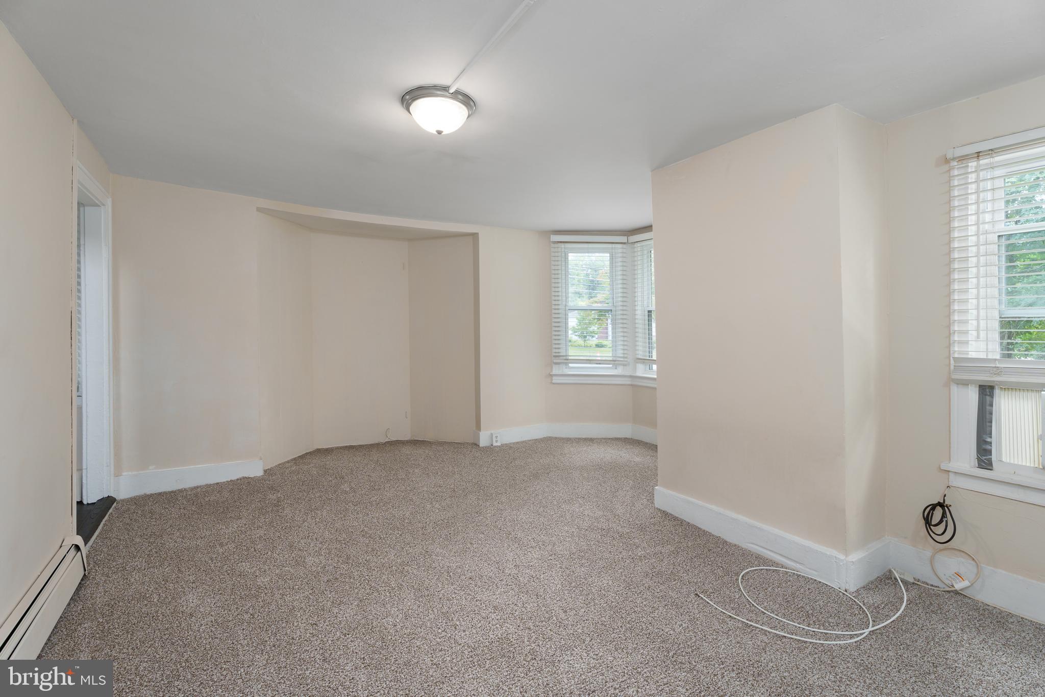 124 Washington Road, Unit 2 Princeton, NJ 08540 - Photo 7 of 13 an empty room with windows