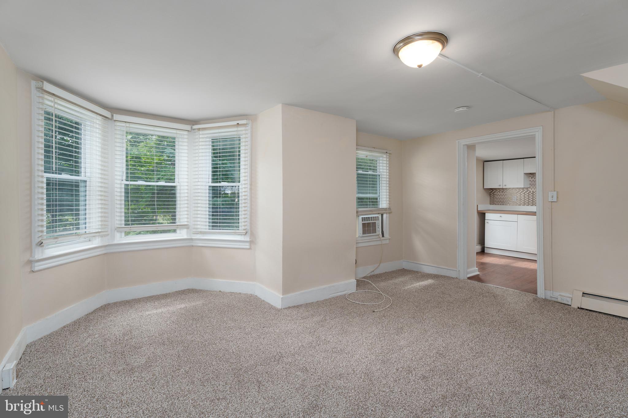 124 Washington Road, Unit 2 Princeton, NJ 08540 - Photo 8 of 13 an empty room with windows