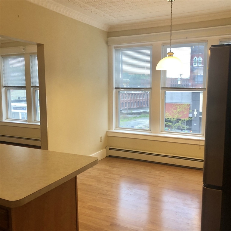 27 High Street, Unit 1 Clinton, MA 01510 - Photo 4 of 30 a view of a room with wooden floor and a window