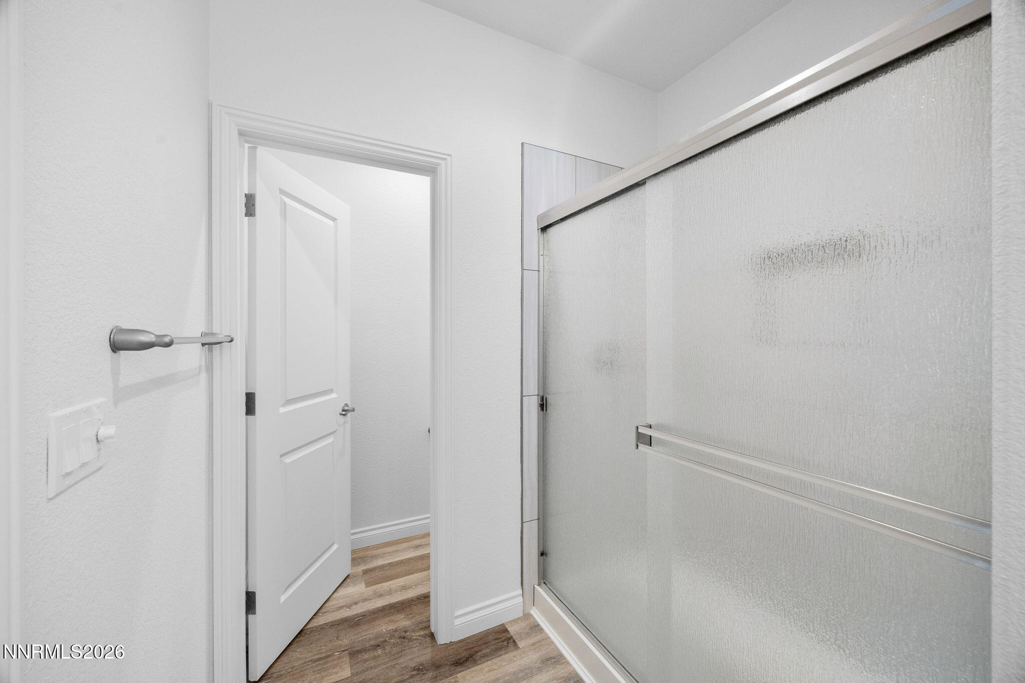 19013 Alpine Walk Reno, NV 89508 - Photo 22 of 34 a bathroom with a glass shower door