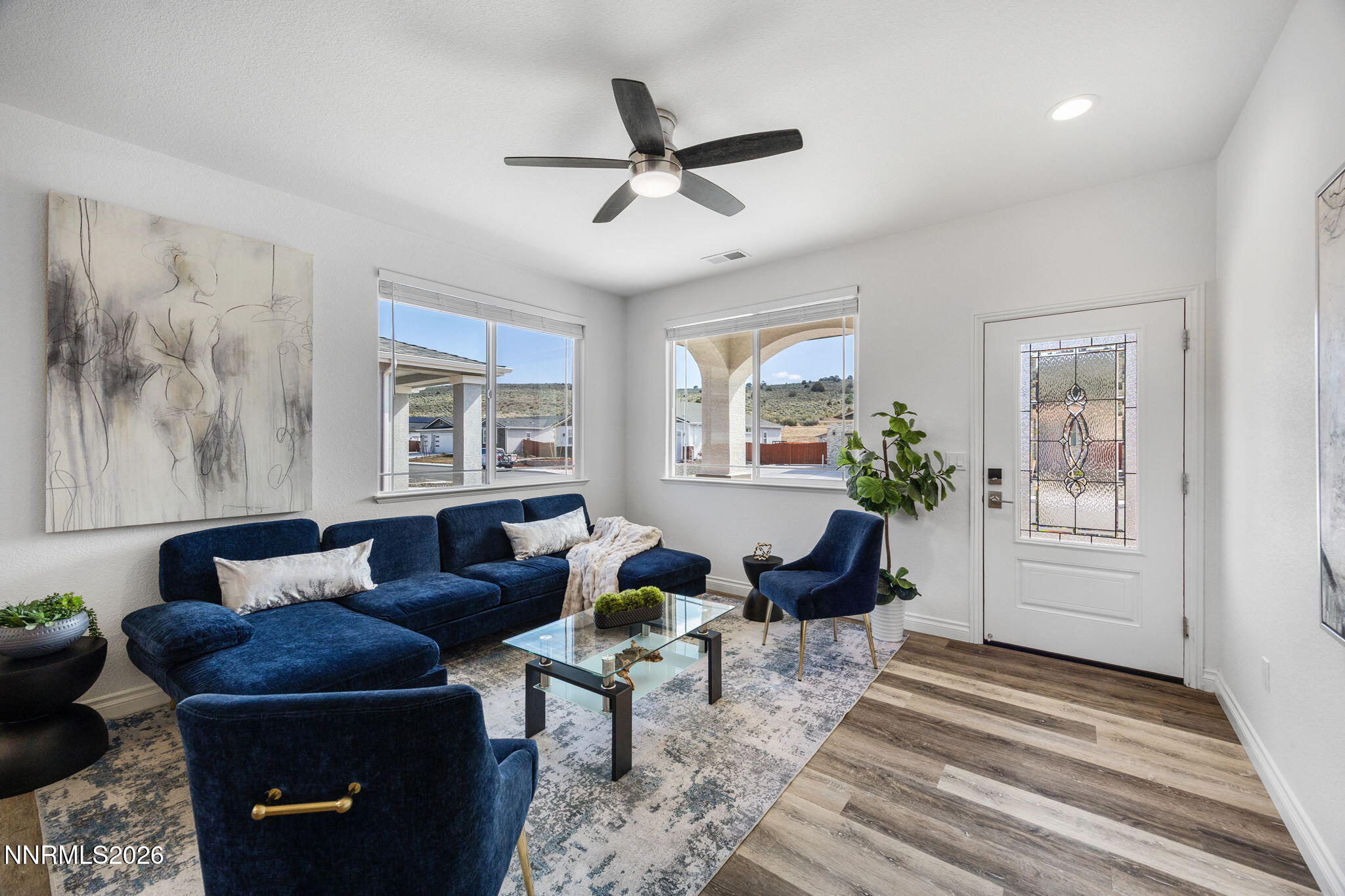 19013 Alpine Walk Reno, NV 89508 - Photo 5 of 34 a living room with furniture a window and a potted plant