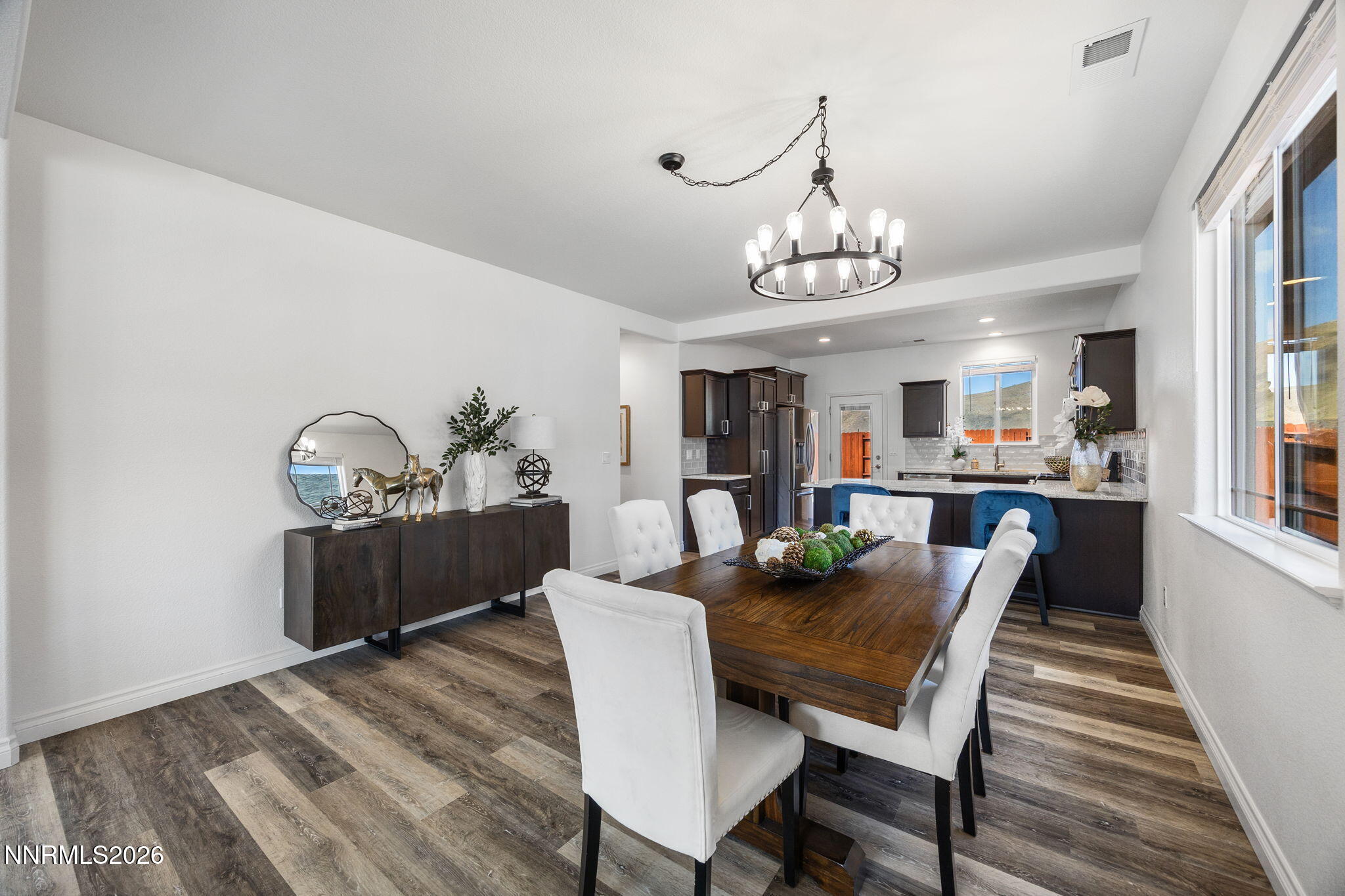 19013 Alpine Walk Reno, NV 89508 - Photo 9 of 34 a view of a dining room with furniture window and wooden floor