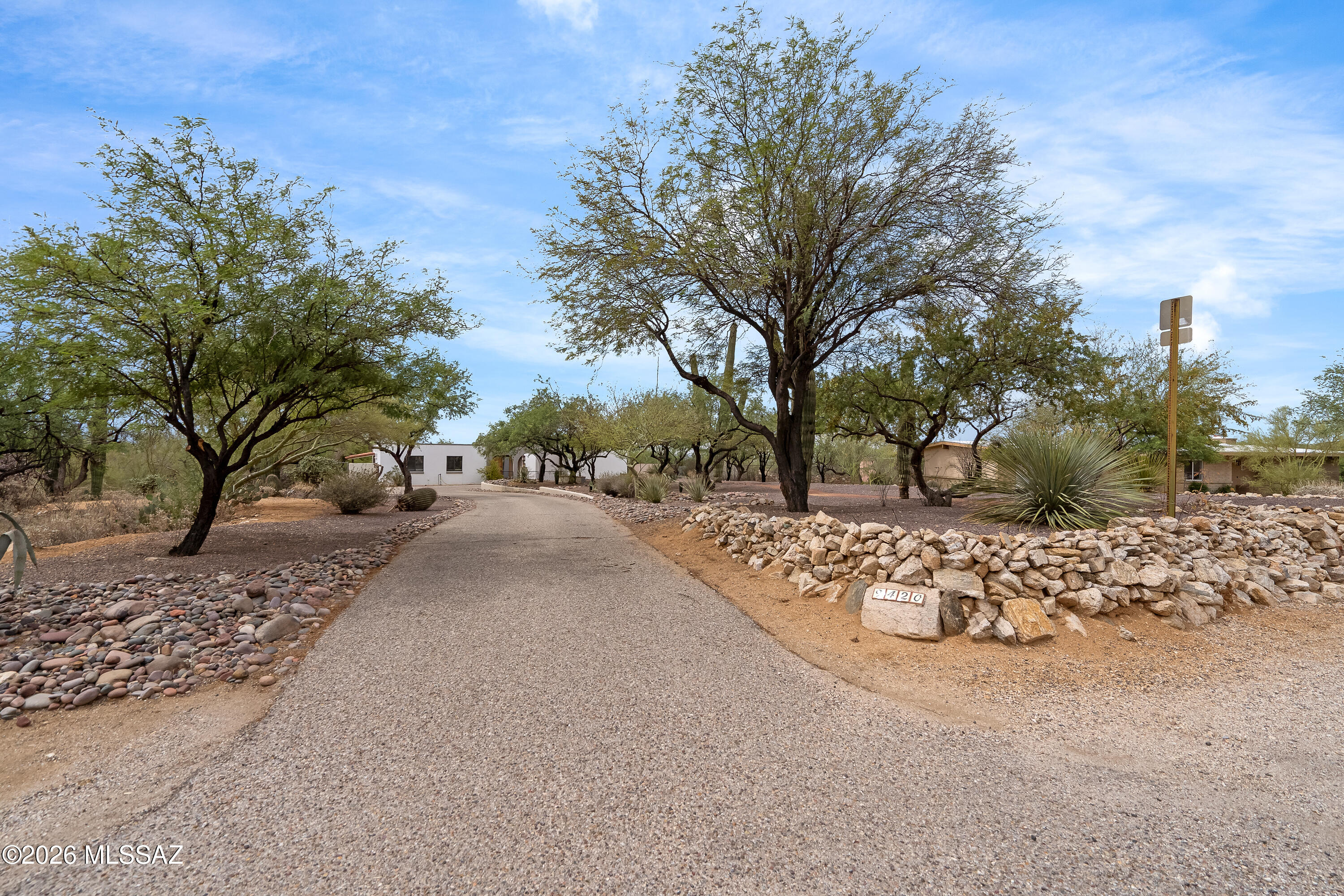 9420 East Ravine Trail Tucson, AZ 85749 - Photo 28 of 39 a view of a road with a trees