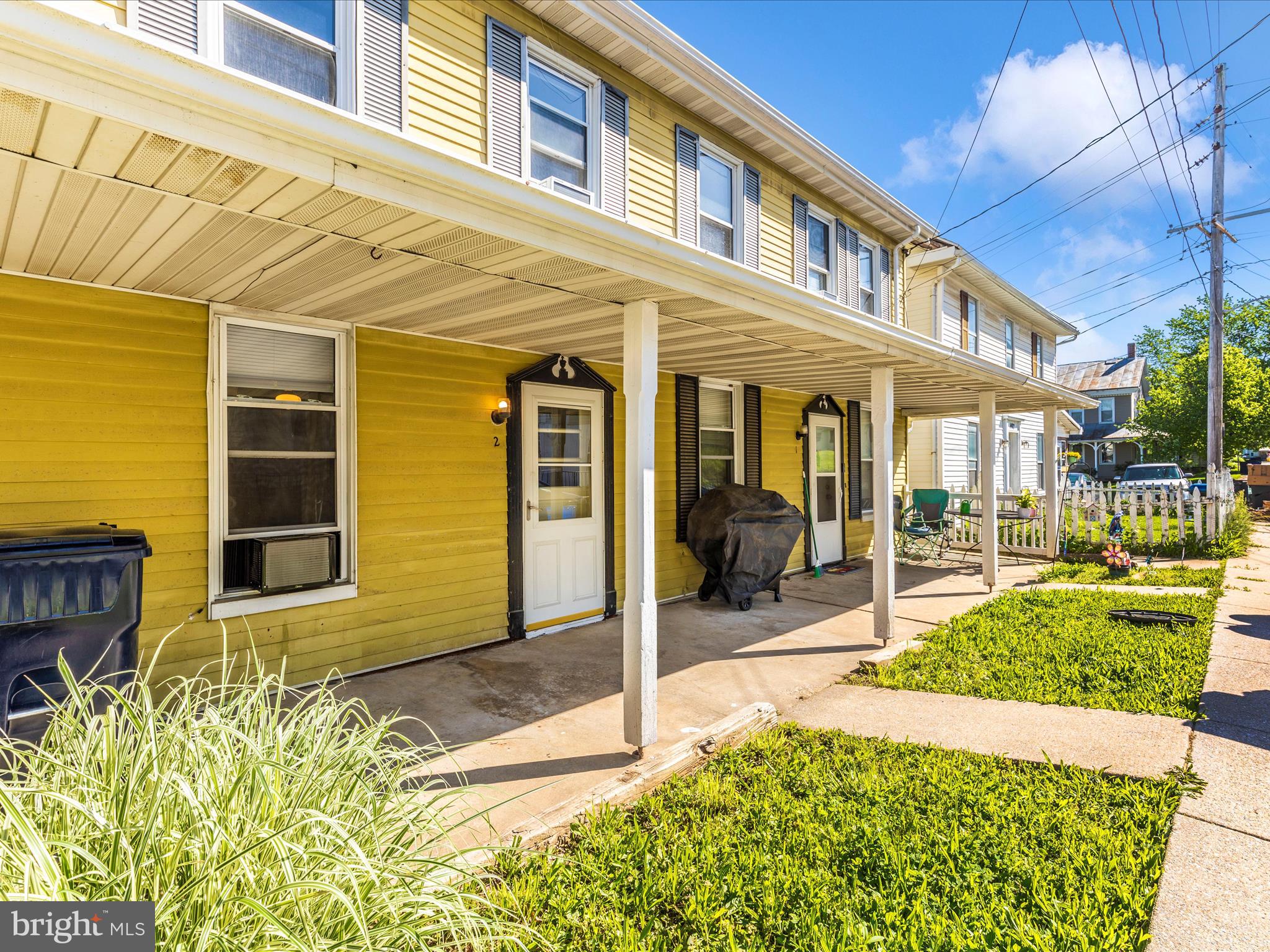 1404 Pleasant Valley Road, Unit 2 Westminster, MD 21158 - Photo 11 of 43 a front view of a house with a yard