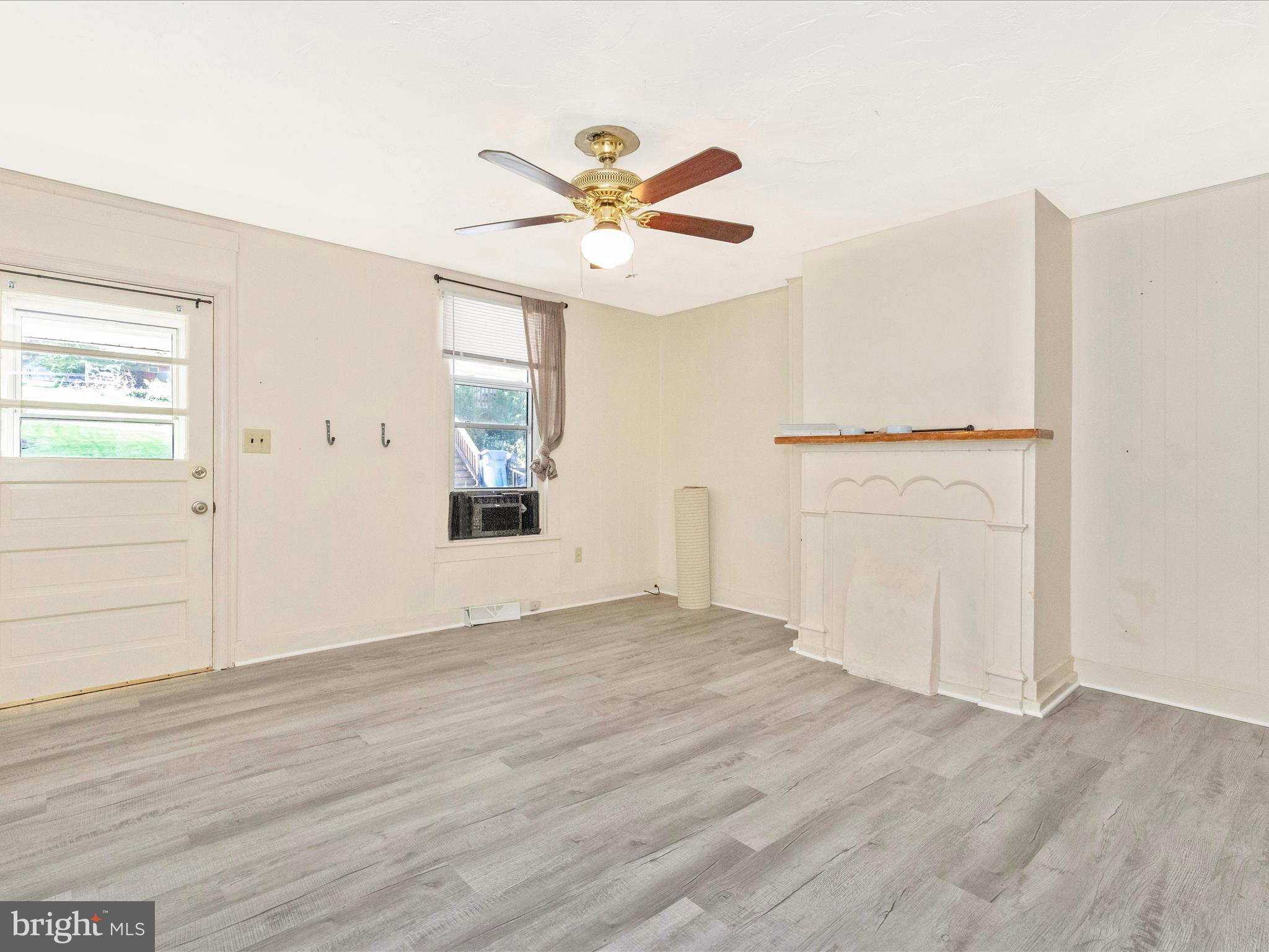 1404 Pleasant Valley Road, Unit 2 Westminster, MD 21158 - Photo 12 of 43 wooden floor in an empty room with a window