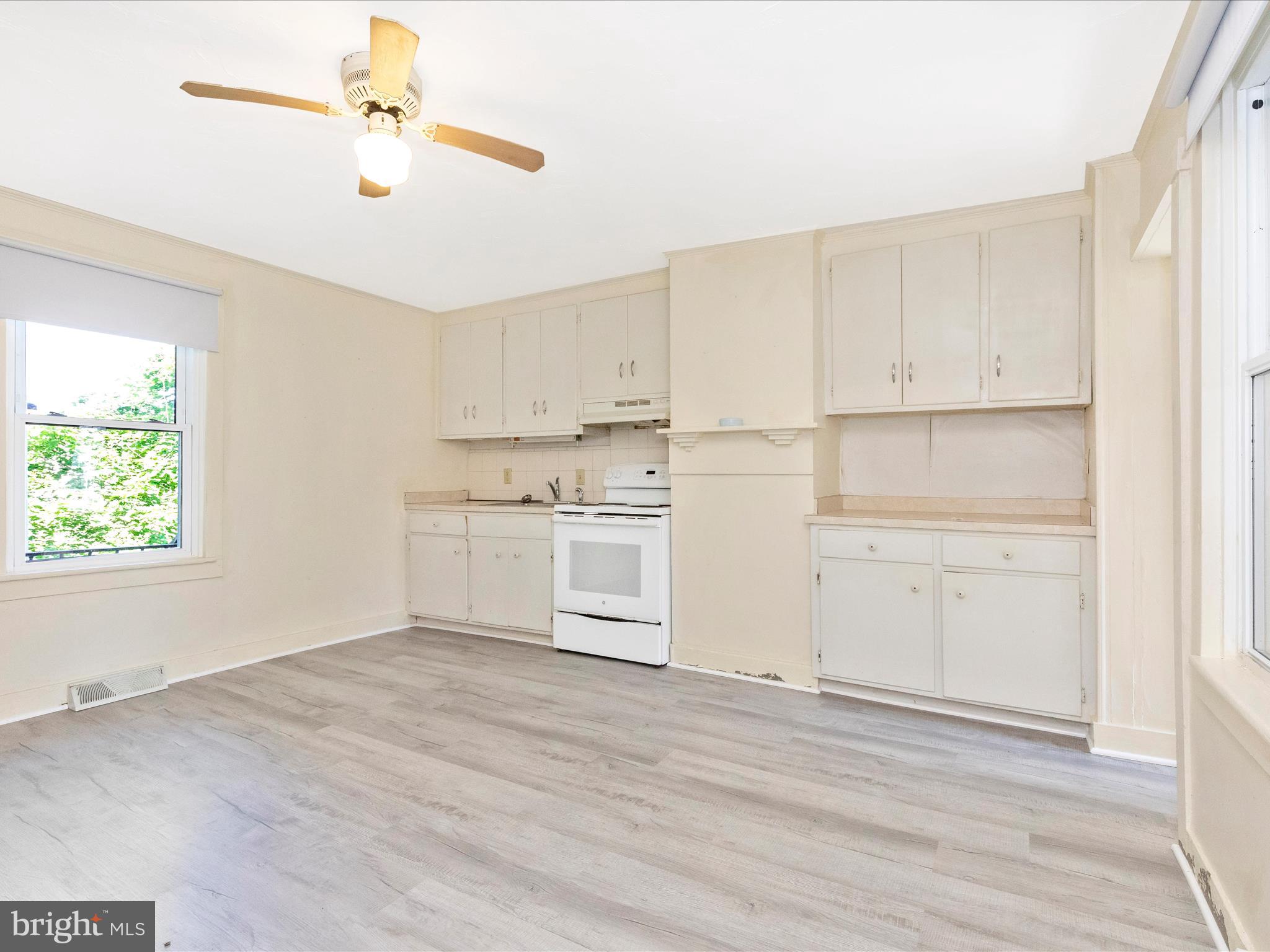 1404 Pleasant Valley Road, Unit 2 Westminster, MD 21158 - Photo 17 of 43 a kitchen with white cabinets and white appliances