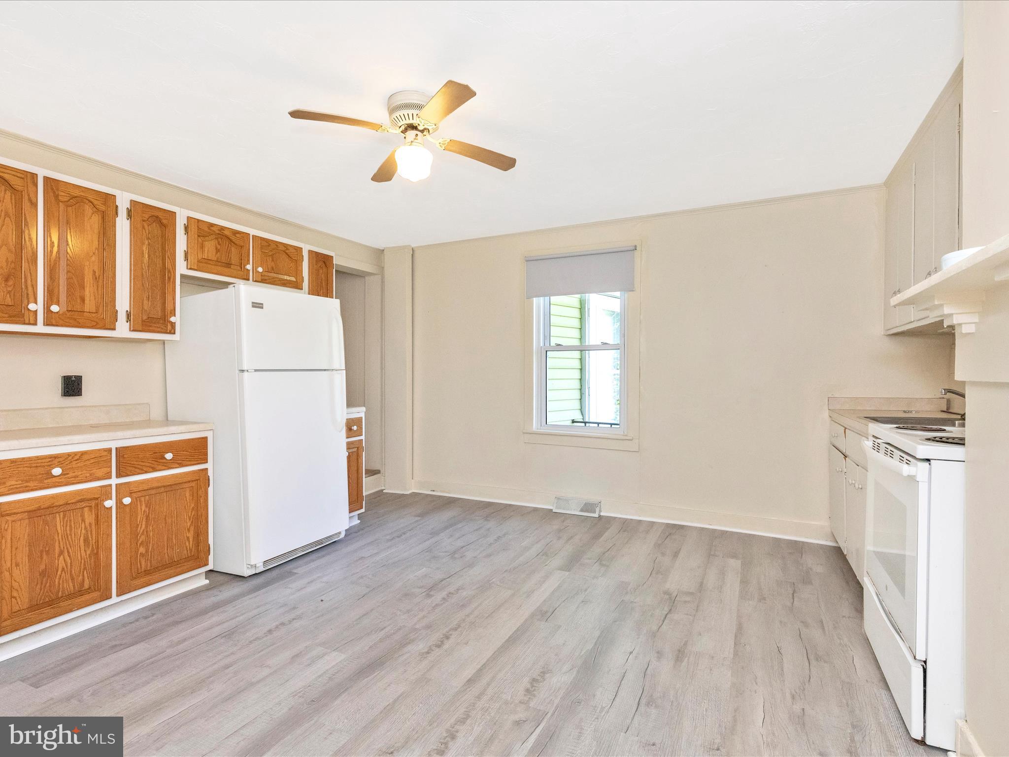 1404 Pleasant Valley Road, Unit 2 Westminster, MD 21158 - Photo 19 of 43 wooden floor in an empty room with a window
