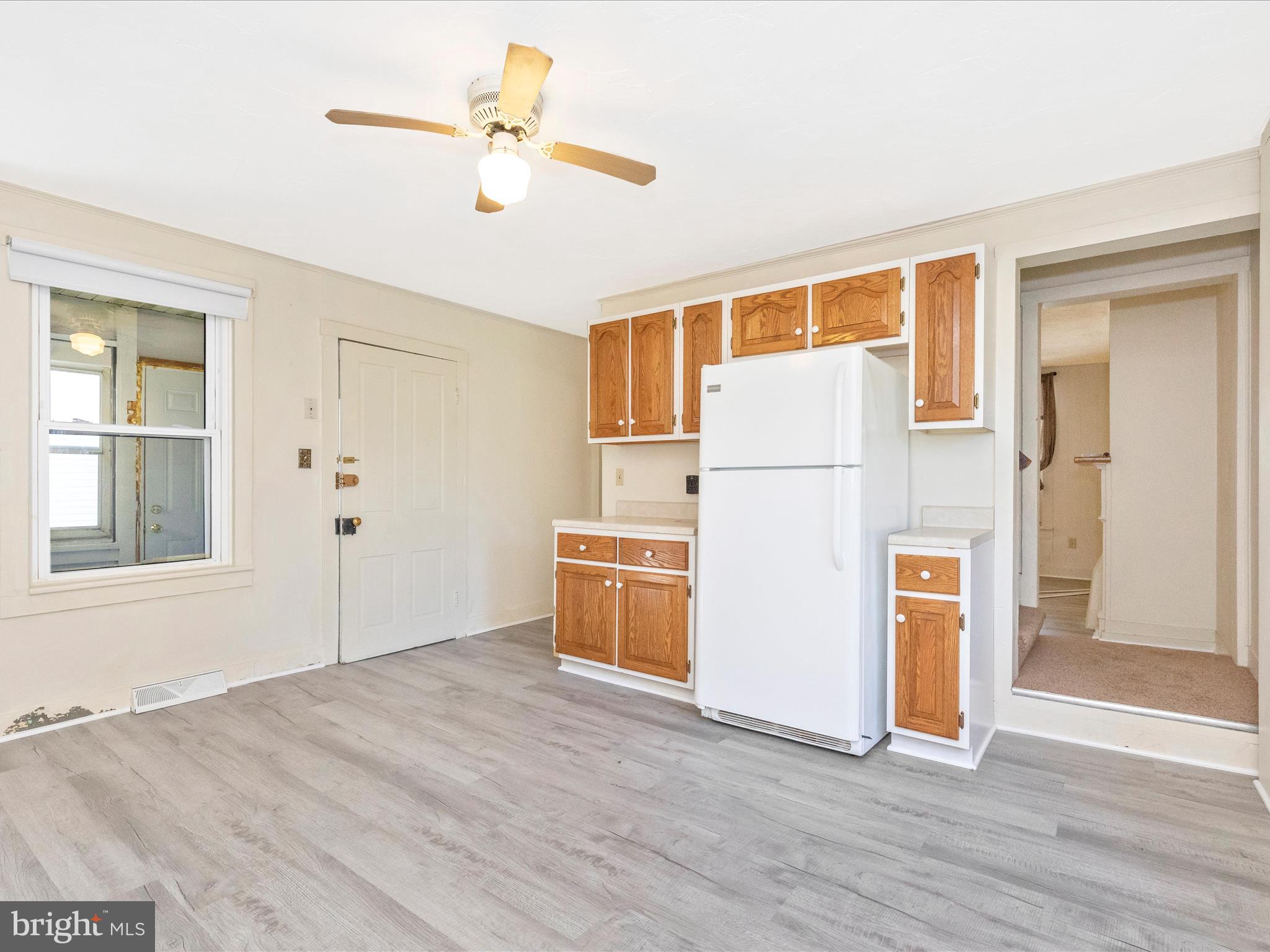 1404 Pleasant Valley Road, Unit 2 Westminster, MD 21158 - Photo 20 of 43 a view of kitchen with wooden floor electronic appliances and window