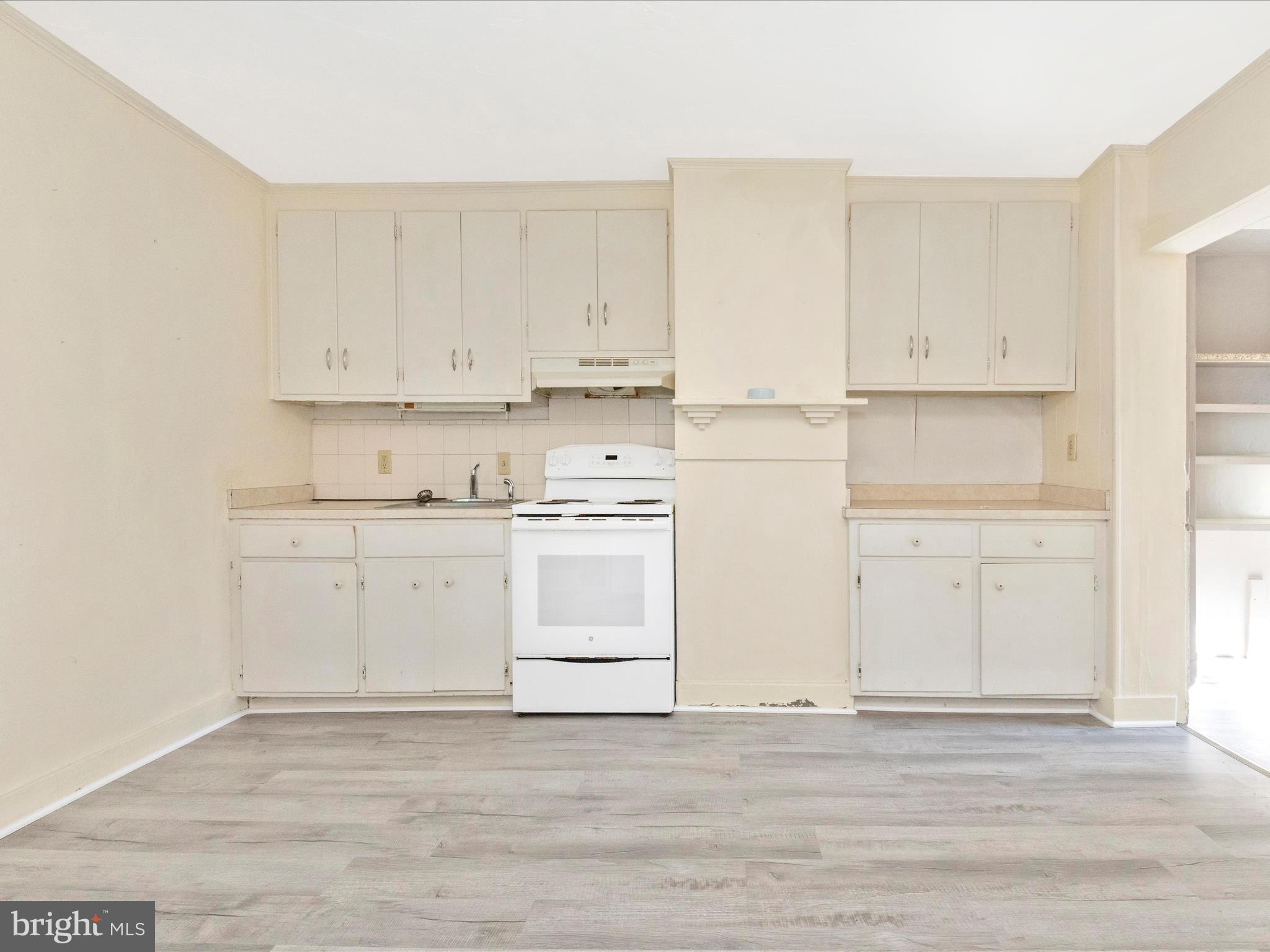 1404 Pleasant Valley Road, Unit 2 Westminster, MD 21158 - Photo 25 of 43 a view of kitchen with white cabinets and white appliances