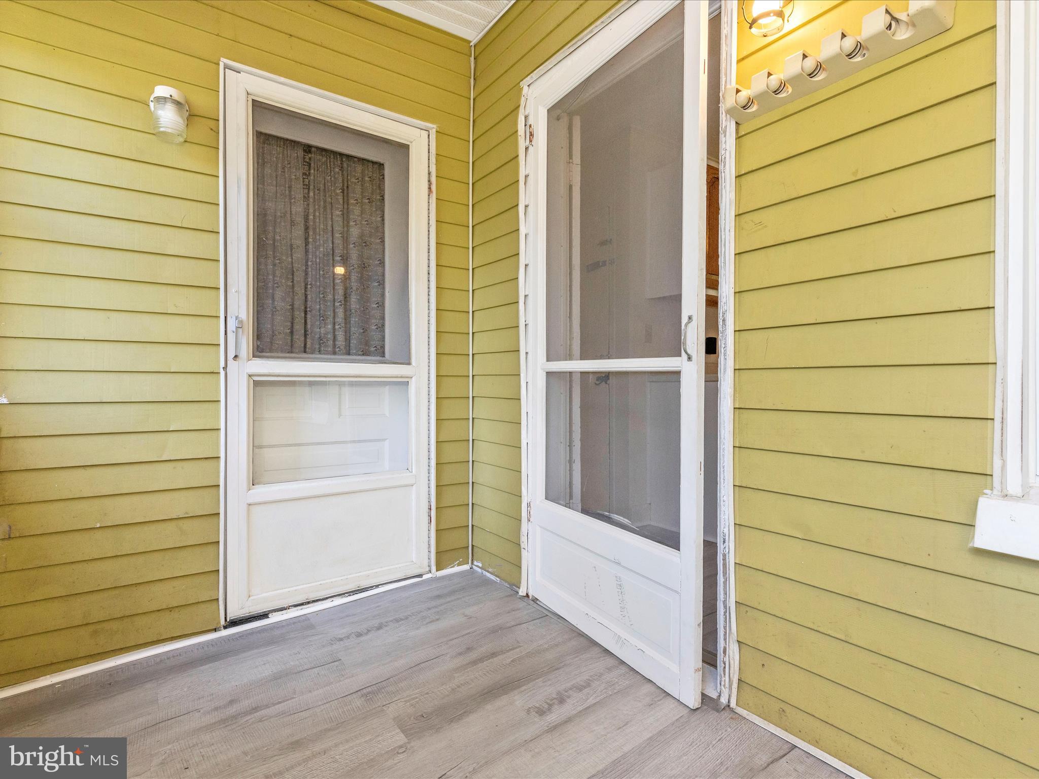 1404 Pleasant Valley Road, Unit 2 Westminster, MD 21158 - Photo 29 of 43 a view of front door and wooden door