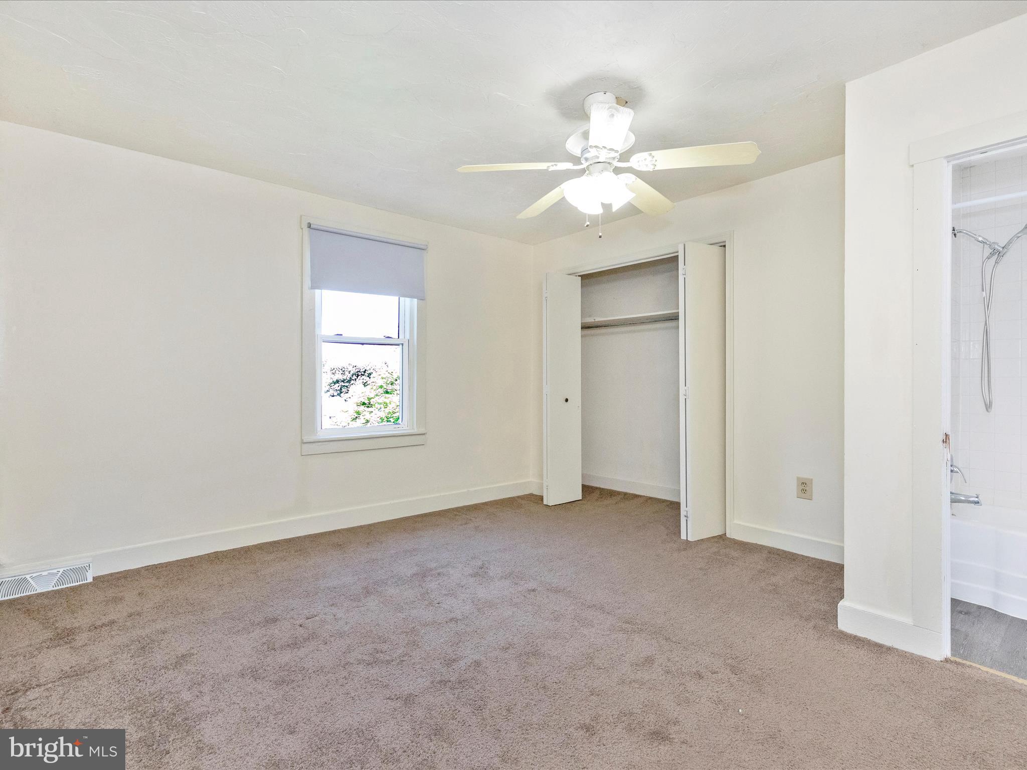 1404 Pleasant Valley Road, Unit 2 Westminster, MD 21158 - Photo 31 of 43 an empty room with windows and fan
