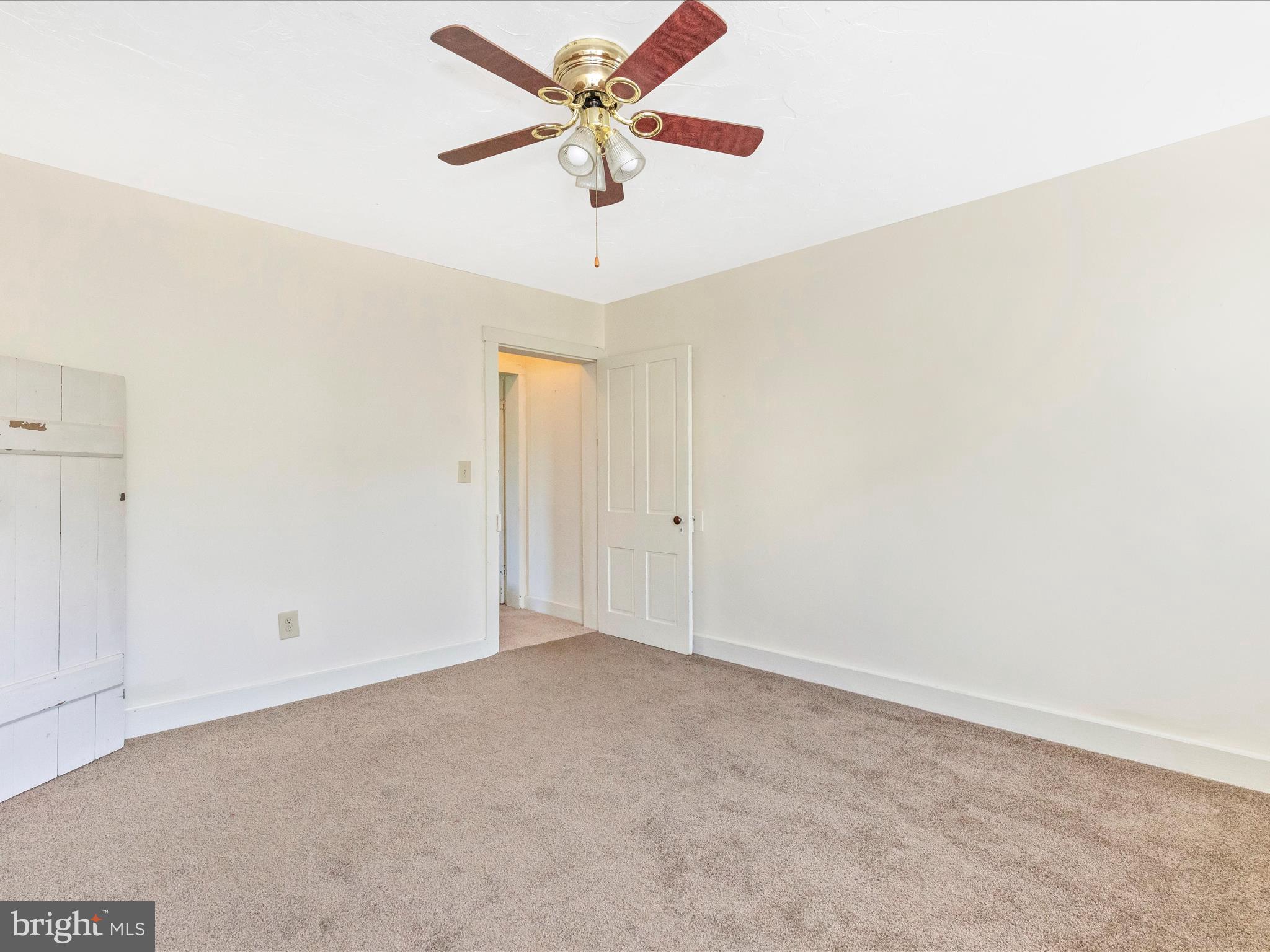 1404 Pleasant Valley Road, Unit 2 Westminster, MD 21158 - Photo 40 of 43 an empty room with a window and a fan
