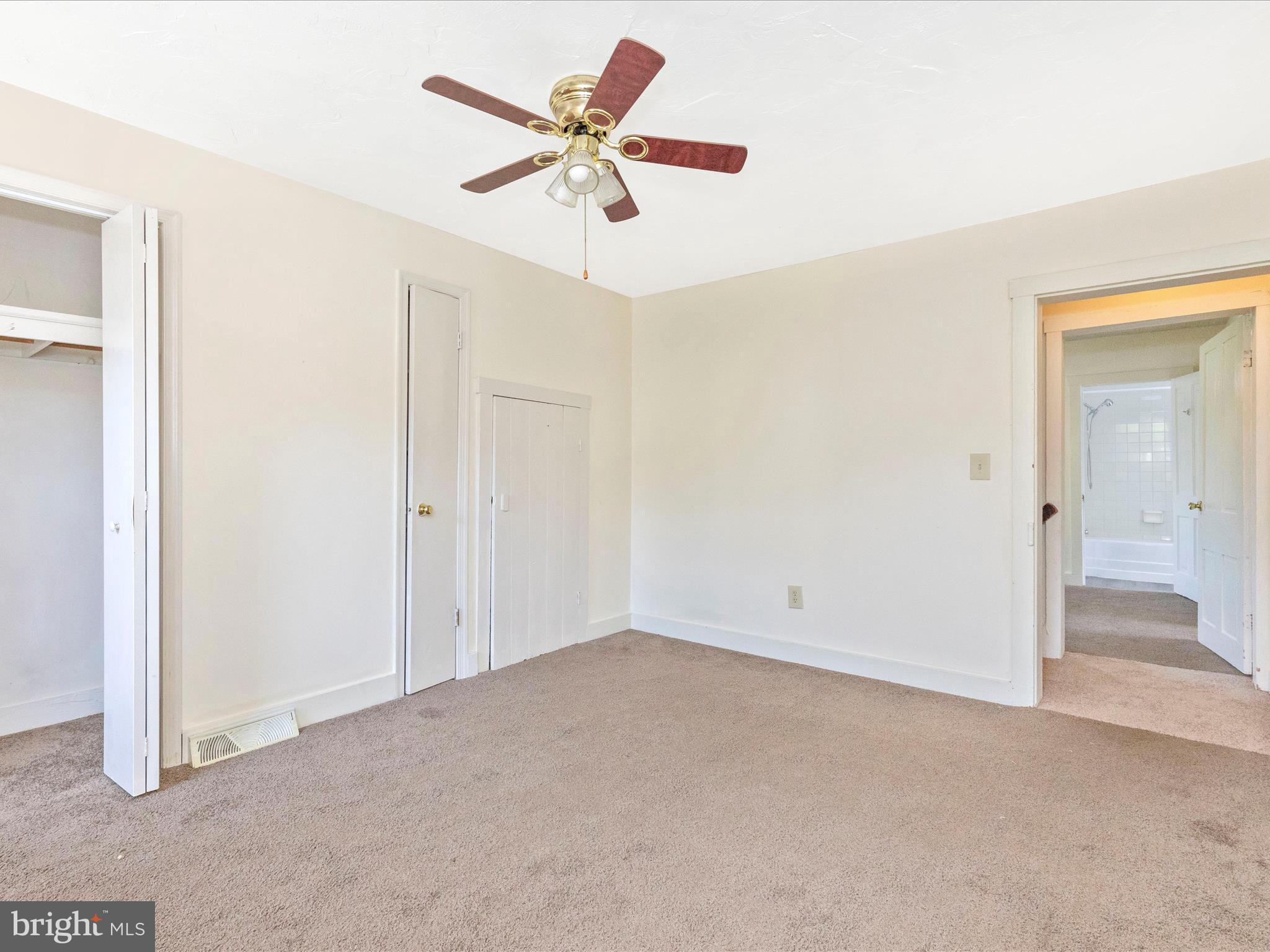 1404 Pleasant Valley Road, Unit 2 Westminster, MD 21158 - Photo 42 of 43 an empty room with closet and fan