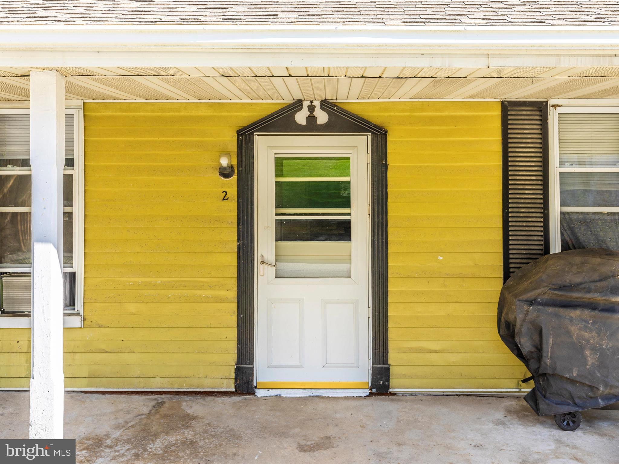 1404 Pleasant Valley Road, Unit 2 Westminster, MD 21158 - Photo 5 of 43 a front view of a house with a parking area