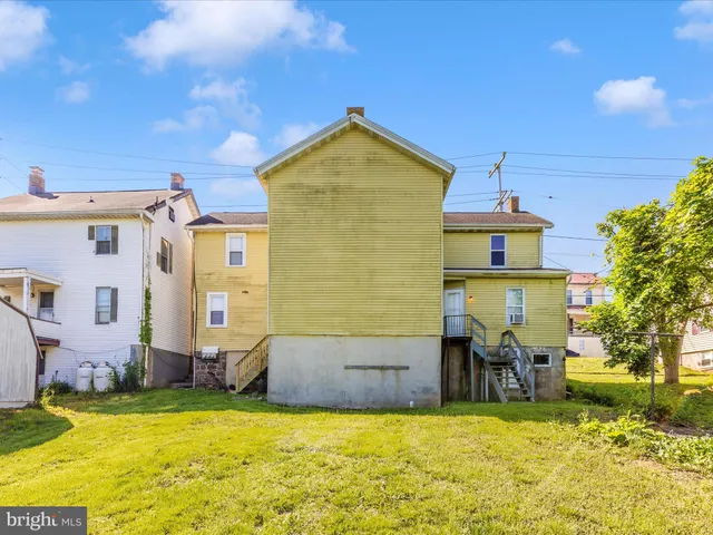a swimming pool with wooden fence