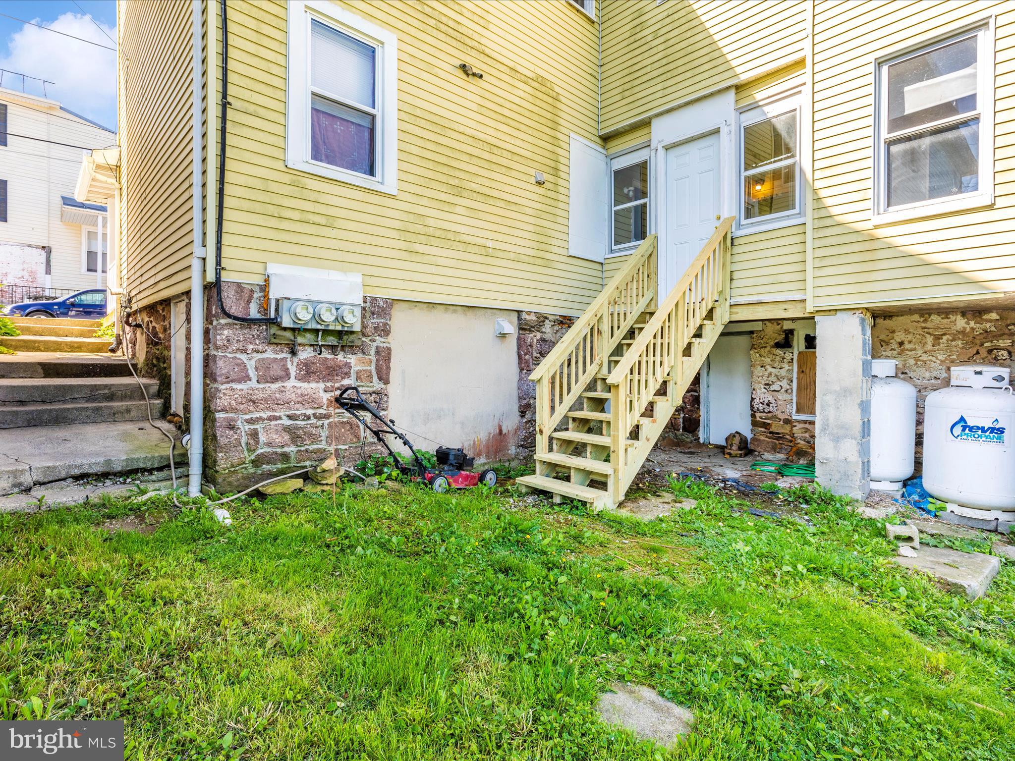 1404 Pleasant Valley Road, Unit 2 Westminster, MD 21158 - Photo 10 of 43 a view of a house with a yard and stairs