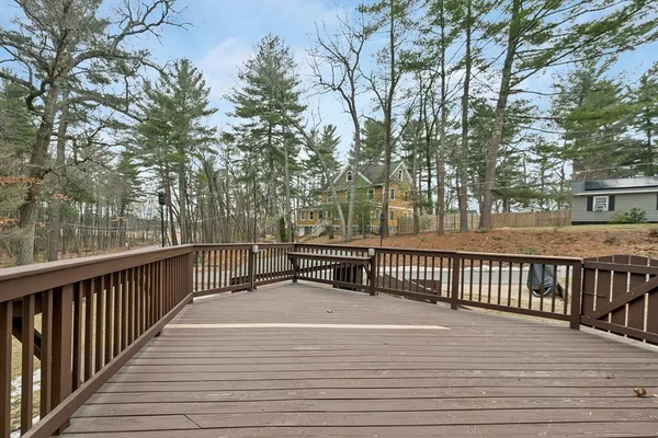 a terrace view with wooden floor and fence