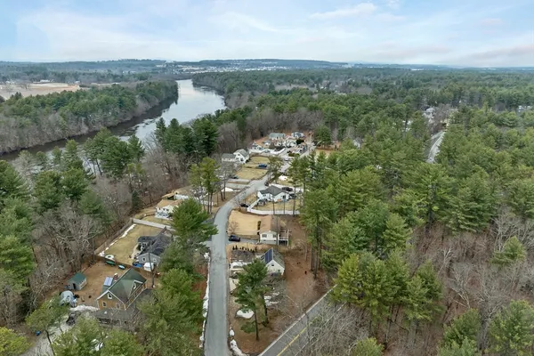 an aerial view of a houses with outdoor space and lake view