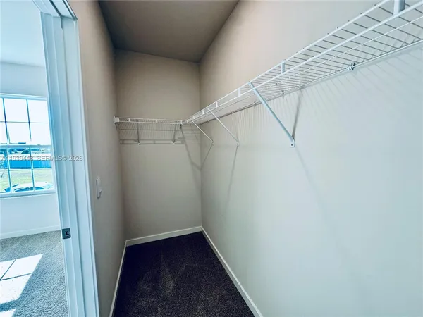 a view of a room with racks on the wall