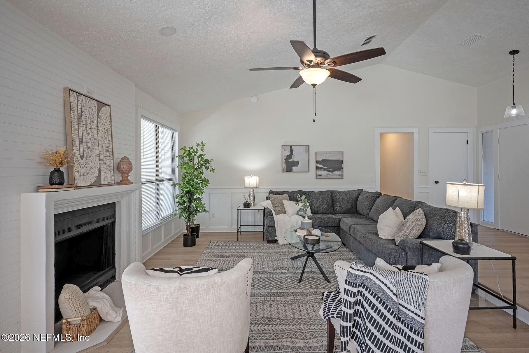 2451 Ridgecrest Avenue Orange Park, FL 32065 - Photo 22 of 57 a living room with furniture and a fireplace