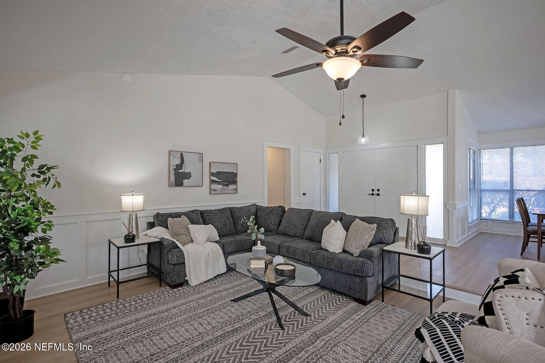 2451 Ridgecrest Avenue Orange Park, FL 32065 - Photo 23 of 57 a living room with furniture and a chandelier