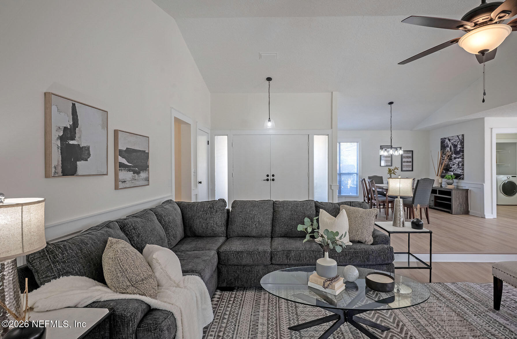 2451 Ridgecrest Avenue Orange Park, FL 32065 - Photo 24 of 57 a living room with furniture kitchen view and a chandelier