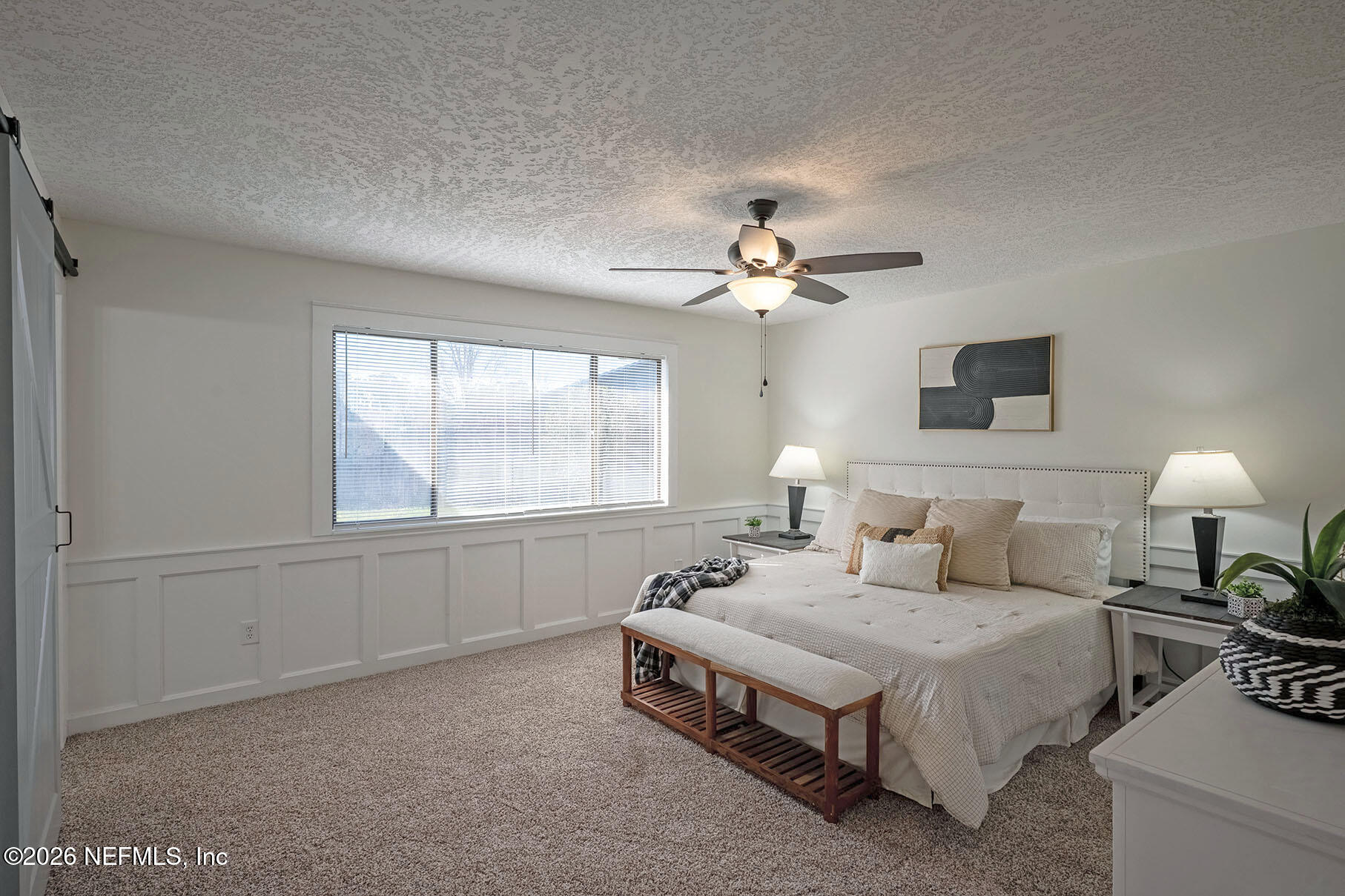 2451 Ridgecrest Avenue Orange Park, FL 32065 - Photo 27 of 57 a spacious bedroom with a bed and window