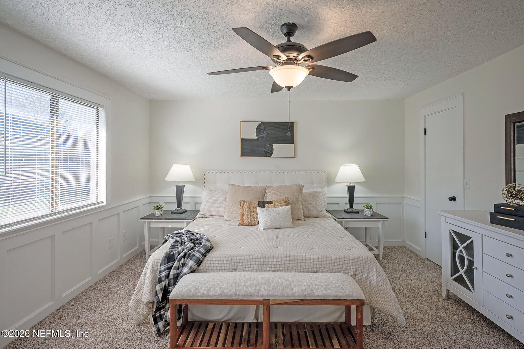 2451 Ridgecrest Avenue Orange Park, FL 32065 - Photo 28 of 57 a bedroom with a bed and a chandelier