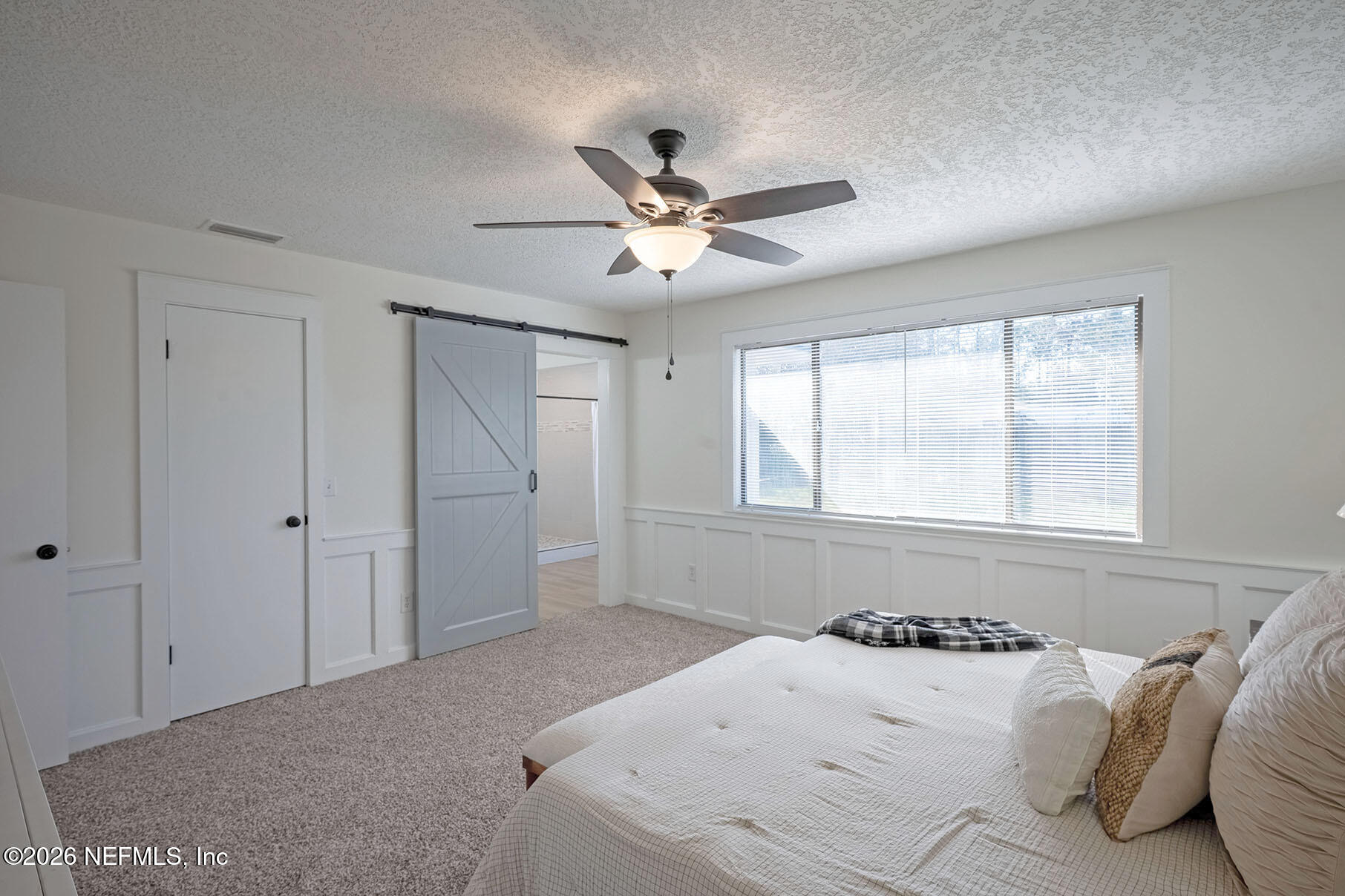 2451 Ridgecrest Avenue Orange Park, FL 32065 - Photo 30 of 57 a bedroom with a large bed and a window