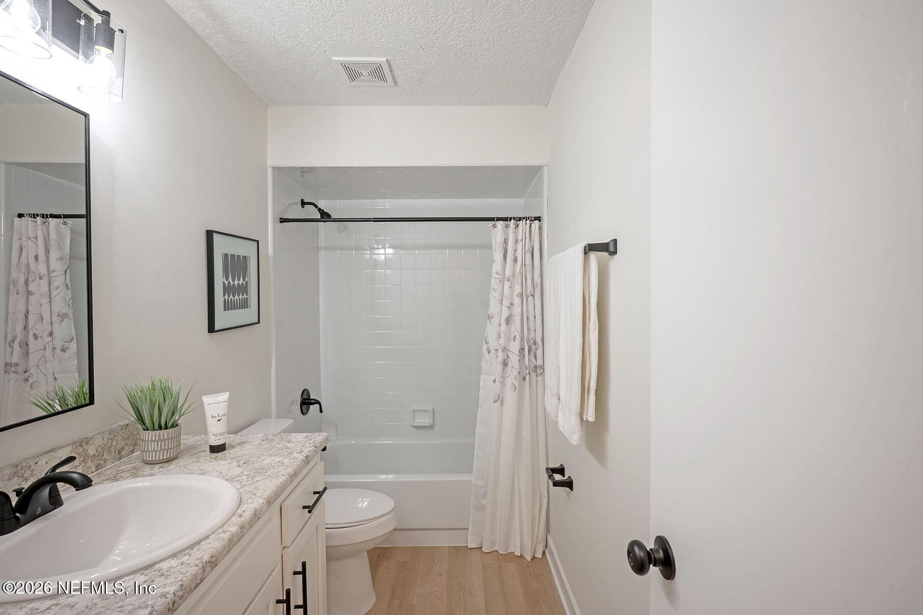 2451 Ridgecrest Avenue Orange Park, FL 32065 - Photo 37 of 57 a bathroom with a granite countertop sink toilet and shower