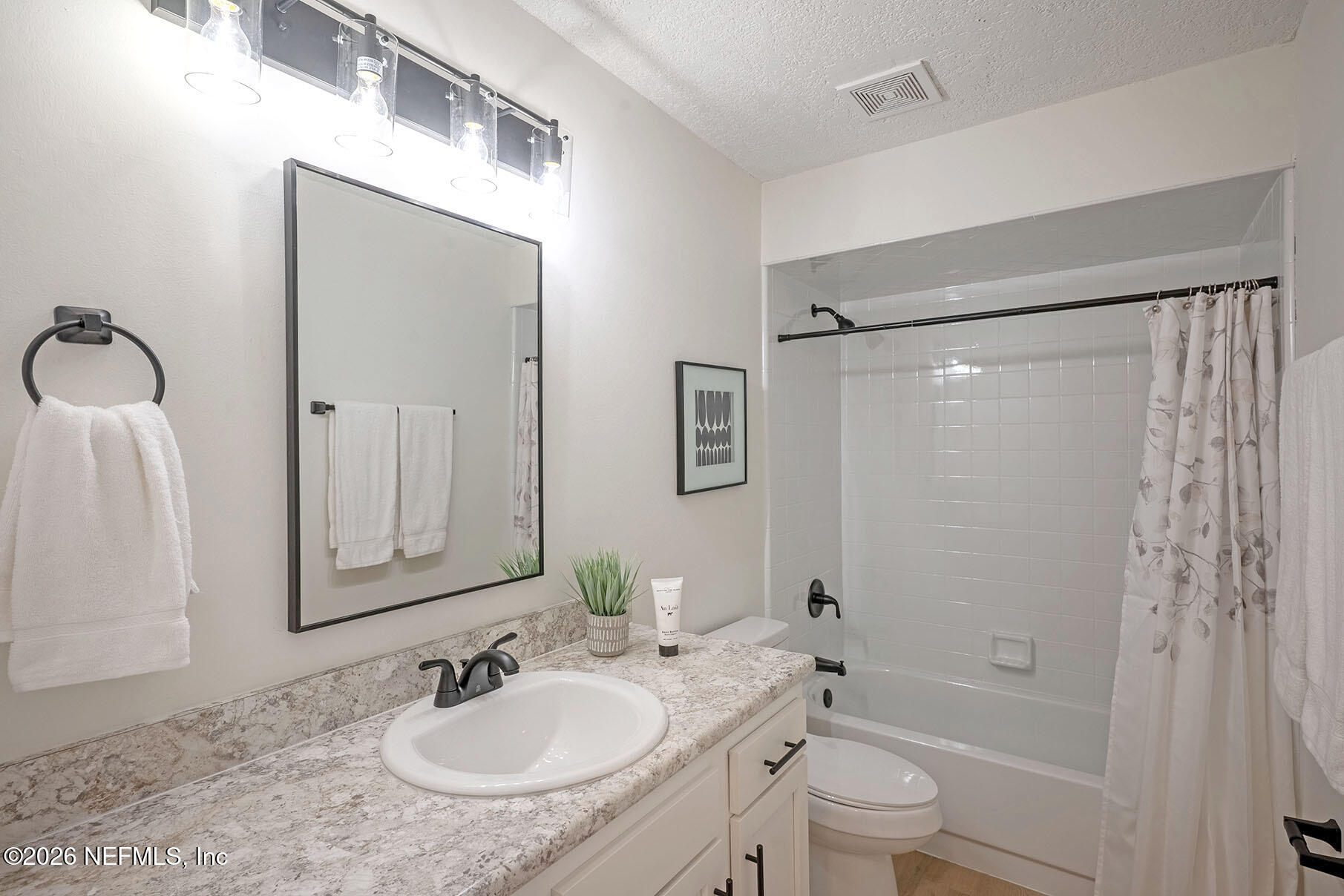 2451 Ridgecrest Avenue Orange Park, FL 32065 - Photo 38 of 57 a bathroom with a granite countertop sink toilet and shower