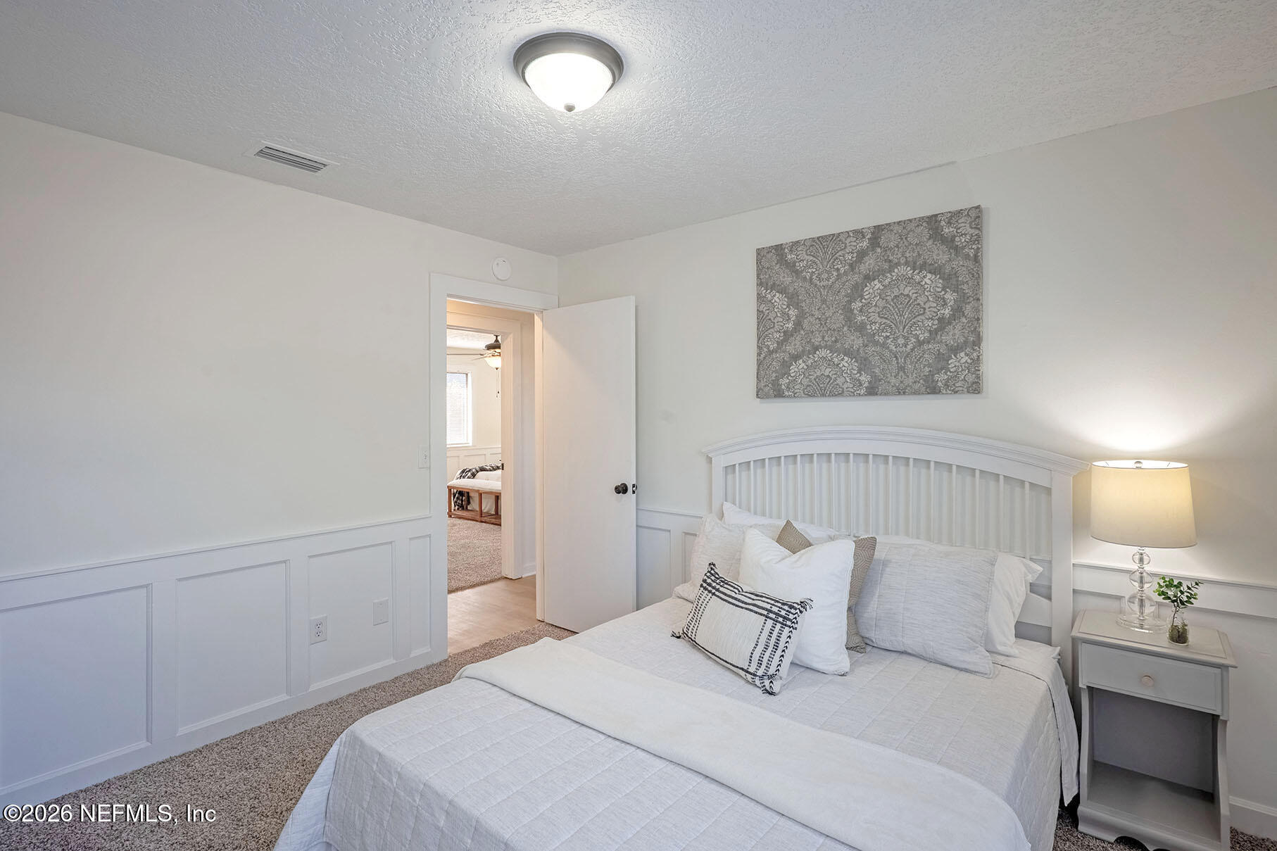 2451 Ridgecrest Avenue Orange Park, FL 32065 - Photo 40 of 57 a bedroom with a bed and a night lamp