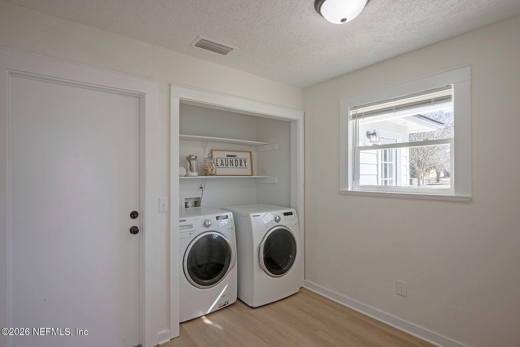 2451 Ridgecrest Avenue Orange Park, FL 32065 - Photo 42 of 57 a utility room with dryer and washer