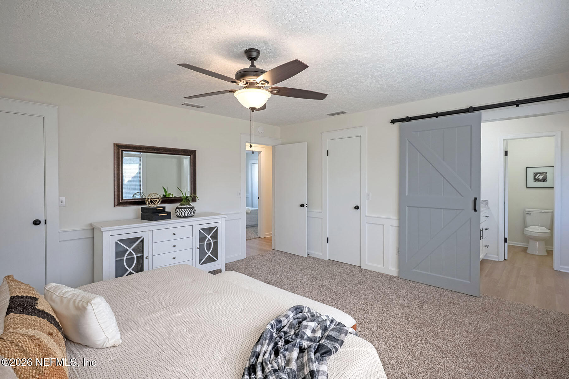 2451 Ridgecrest Avenue Orange Park, FL 32065 - Photo 7 of 57 a bedroom with a bed and a flat screen tv