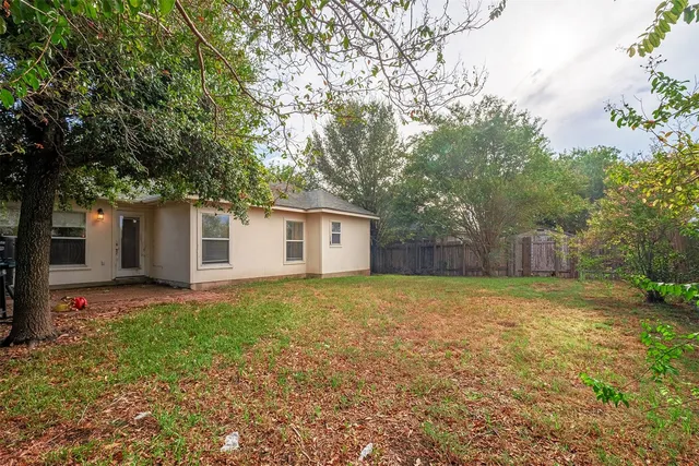 a house with trees in front of it