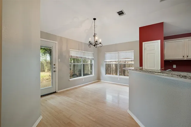 a view of an empty room with a window