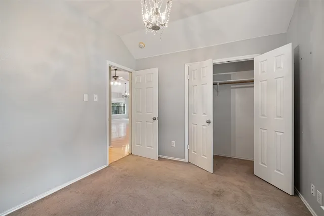 a view of a chandelier in big room and chandelier