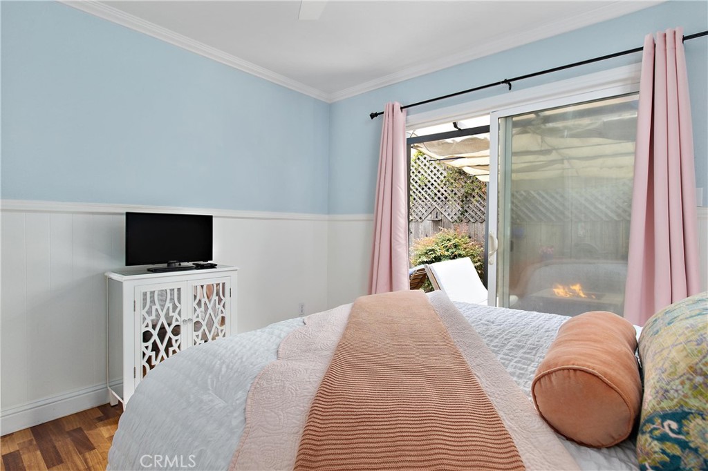 440 Java Street Morro Bay, CA 93442 - Photo 13 of 22 a bedroom with a bed and a flat screen tv