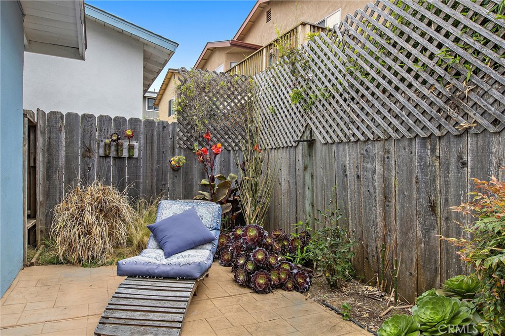 440 Java Street Morro Bay, CA 93442 - Photo 20 of 22 a view of a chairs and table in backyard