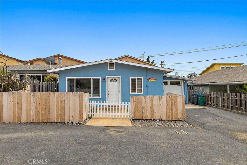 440 Java Street Morro Bay, CA 93442 - Photo 5 of 22 a front view of a house with a garden