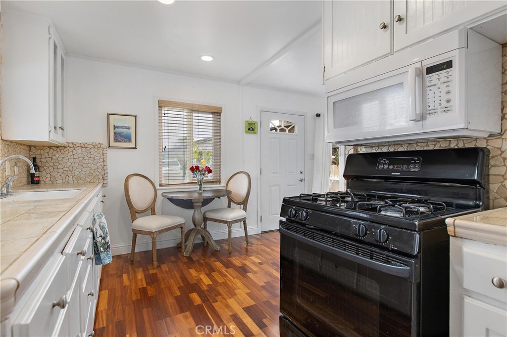 440 Java Street Morro Bay, CA 93442 - Photo 10 of 22 a kitchen with a stove a sink and a microwave