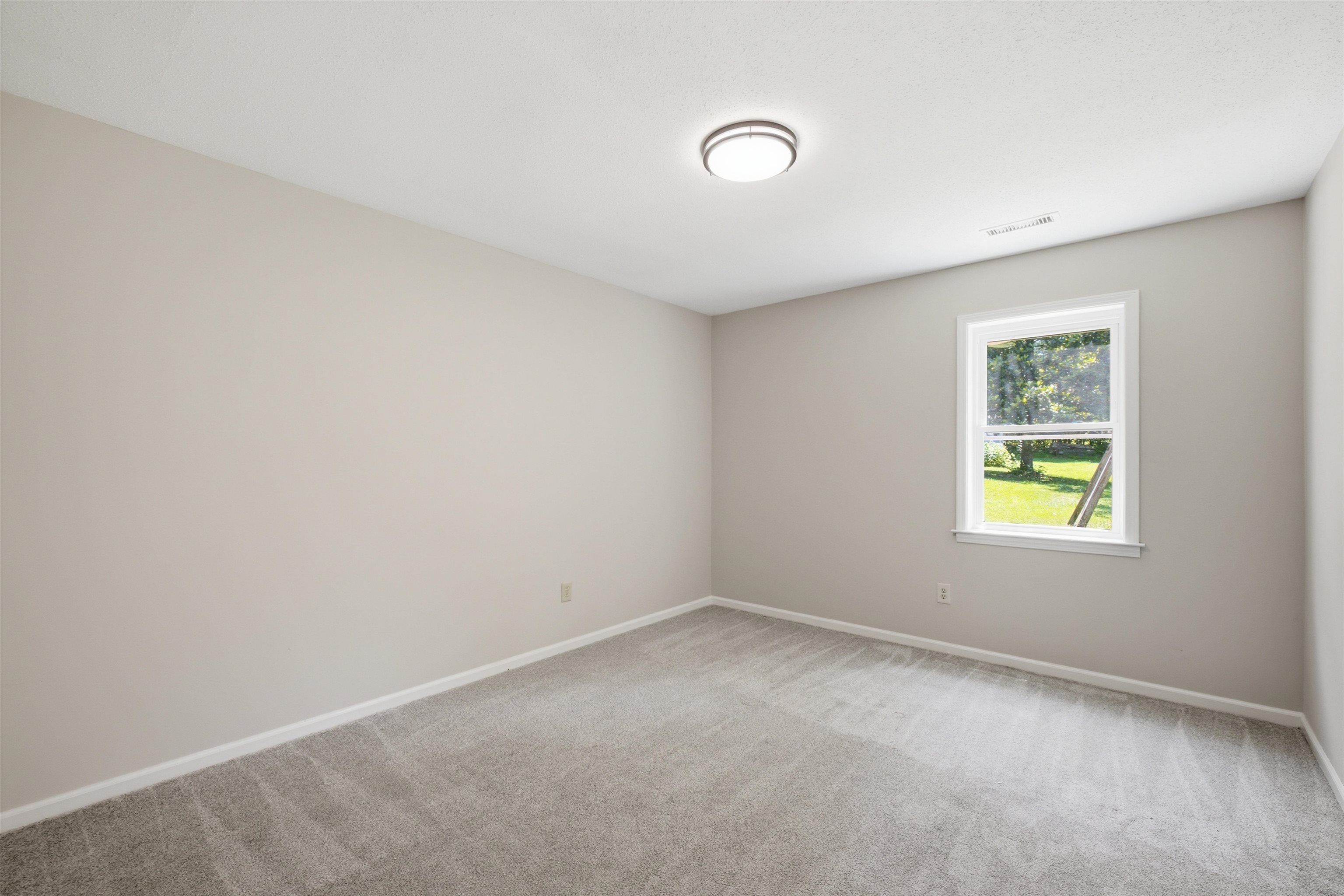 1370 North Reid Hooker Road Eads, TN 38028 - Photo 30 of 39 Neutral-toned room featuring a single window and recessed lighting