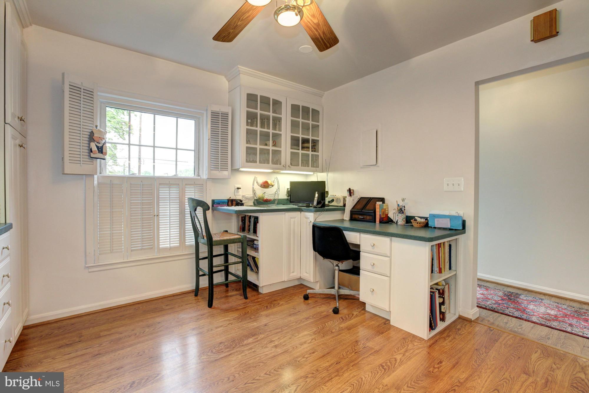 4817 Sangamore Road, Unit 8 Bethesda, MD 20816 - Photo 8 of 28 a view of a dining room with furniture and wooden floor