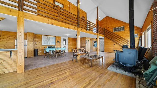 a view of living room with furniture and wooden floor