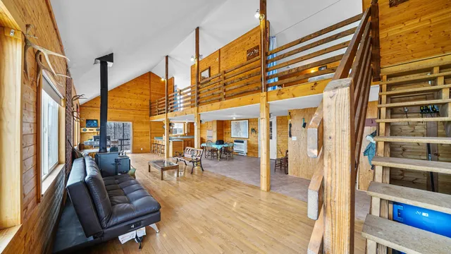 a view of living room with furniture and floor to ceiling windows
