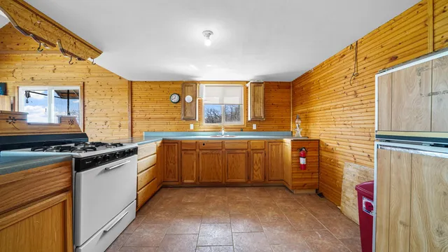 a view of a dining room with furniture and window