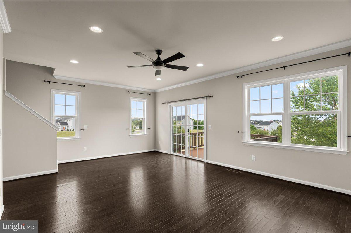 101 Jitterbug Way Stephenson, VA 22656 - Photo 10 of 39 a view of an empty room with wooden floor and a window