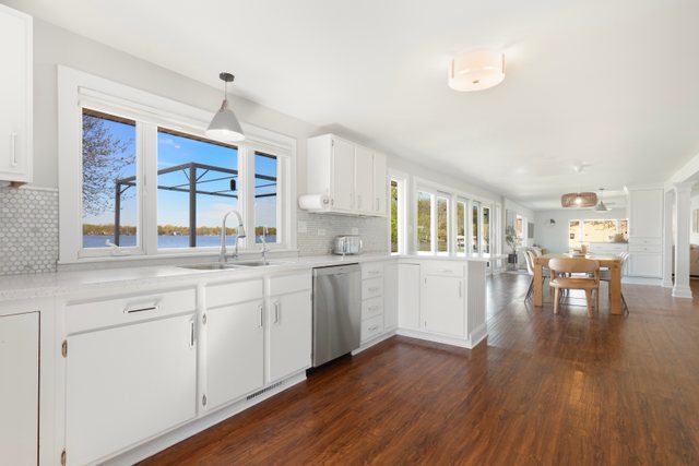 35013 North James Ingleside, IL 60041 - Photo 15 of 46 a open kitchen with white cabinets and wooden floor