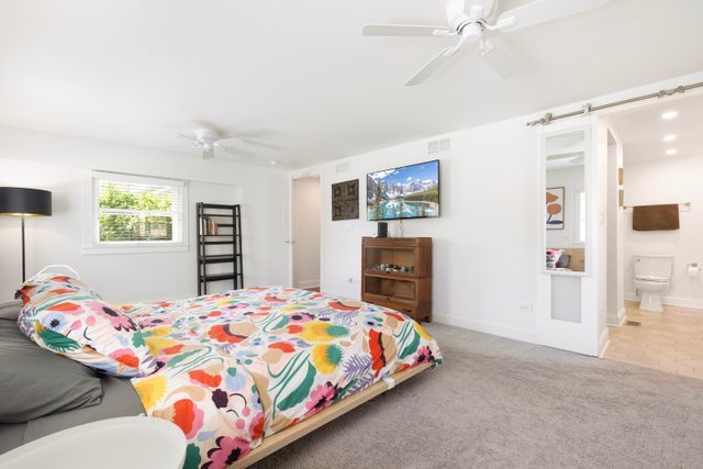 35013 North James Ingleside, IL 60041 - Photo 20 of 46 a bedroom that has a bed and a dresser in it