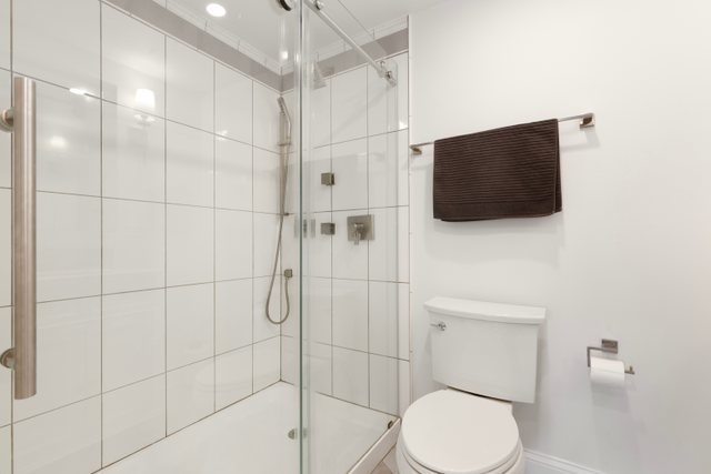 35013 North James Ingleside, IL 60041 - Photo 22 of 46 a bathroom with a toilet a sink and shower